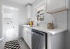 How New Appliance Standards Can Save Households $100 a Year on Energy Bills Bright modern kitchen with white cabinets and stainless steel appliances
