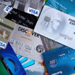 The Hidden Cost of Credit Card Rewards (And How Disciplined Users Benefit) A variety of credit and debit cards spread out on a surface